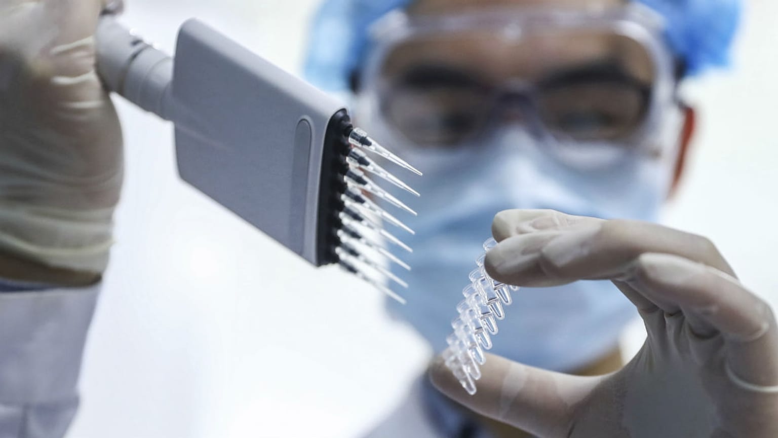 A staff member tests samples of a COVID-19 vaccine in Beijing