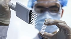 A staff member tests samples of a COVID-19 vaccine in Beijing