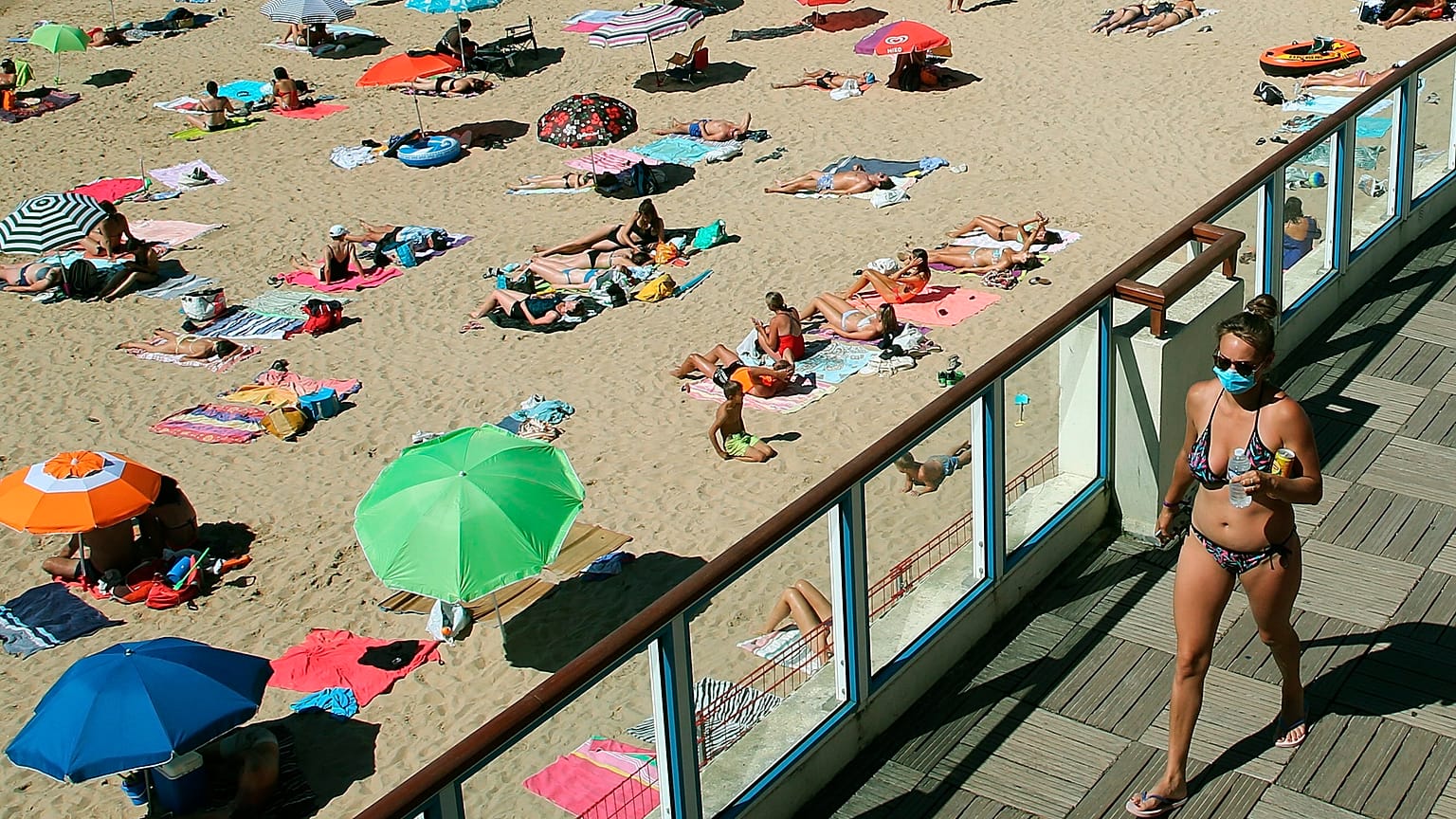A woman wearing a face mask to protect against coronavirus, near the beach, in Saint Jean de Luz, southwestern France. 