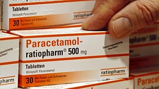 A pharmacist holding a Ratiopharm box of paracetamol in a pharmacy in Berlin, Jan. 8, 2009