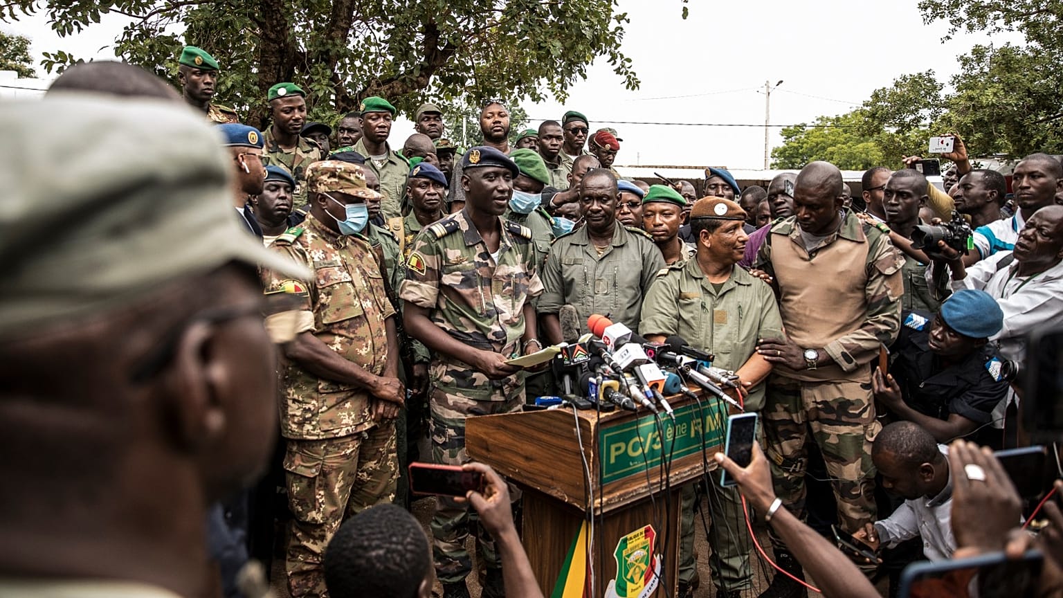 Colonel-Major Ismael Wague, centre, spokesman for the soldiers identifying themselves as National Committee for the Salvation of the People  in Kati, Mali, Wednesday, Aug. 19.