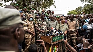 Colonel-Major Ismael Wague, centre, spokesman for the soldiers identifying themselves as National Committee for the Salvation of the People in Kati, Mali, Wednesday, Aug. 19.