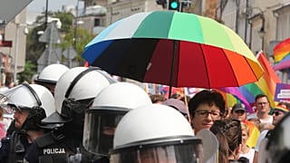 Police escort LGBT activists and their supporters during the first-ever pride parade in the central city of Plock, Poland, on Saturday Aug. 10, 2019. 