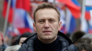 FILE - In this Sunday, Feb. 24, 2019 file photo, Russian opposition activist Alexei Navalny takes part in a march in memory of opposition leader Boris Nemtsov in Moscow.