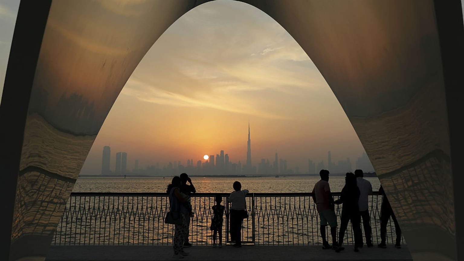  People enjoy a city skyline view with the World's tallest building Burj Khalifa, in Dubai, United Arab Emirates