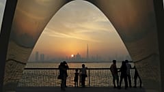  People enjoy a city skyline view with the World's tallest building Burj Khalifa, in Dubai, United Arab Emirates