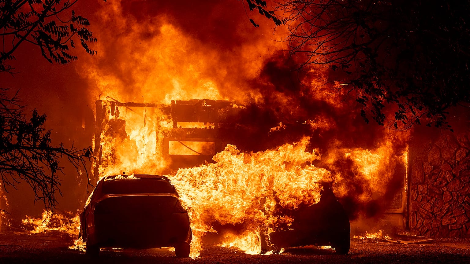 Flames consume a home in Vacaville, California, USA, on August 19, 2020. Fire crews across the region scrambled to contain dozens of wildfires sparked by lightning strikes