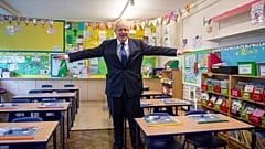  In this Aug. 10, 2020, file photo, Britain's Prime Minister Boris Johnson visits St Joseph's Catholic Primary School, London.