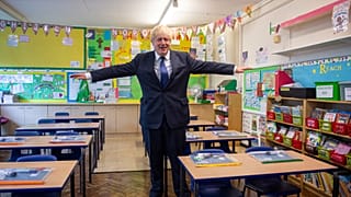 In this Aug. 10, 2020, file photo, Britain's Prime Minister Boris Johnson visits St Joseph's Catholic Primary School, London.