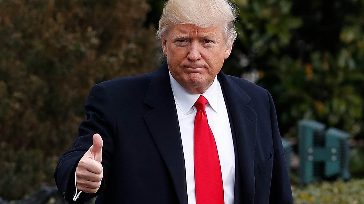 President Donald Trump waves as he walks from White House in Washington, Friday, Feb. 3, 2017