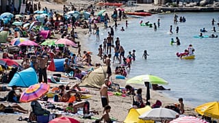 A packed beach at the beginning of a July heatwave in Marseille. The French health ministry has warned that COVID-19 transmission is increasing amid the summer holiday season.