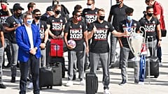 Bavaria Governor Markus Soeder, left, stands with the FC Bayern Munich team after their arrival at Munich Airport, Germany.