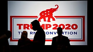 The room is set and delegates begin to arrive for the first day of the Republican National Convention