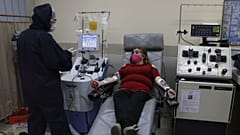 A survivor of the new coronavirus donates her plasma containing COVID-19 antibodies in Bolivia