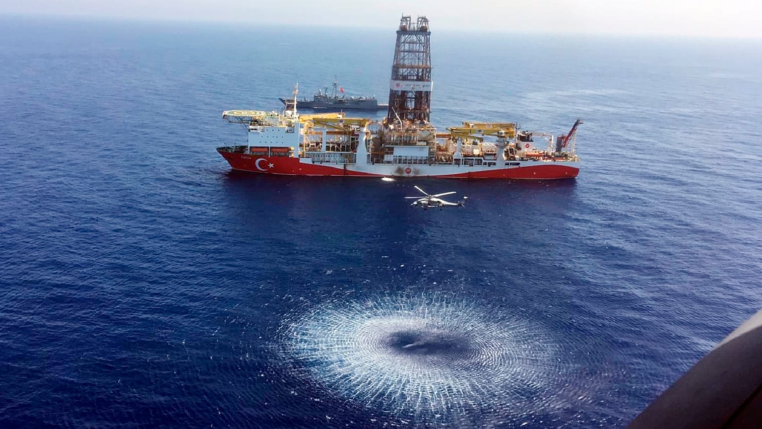 A helicopter flies over Turkey's drilling ship, 'Fatih' dispatched towards the eastern Mediterranean, near Cyprus. 
