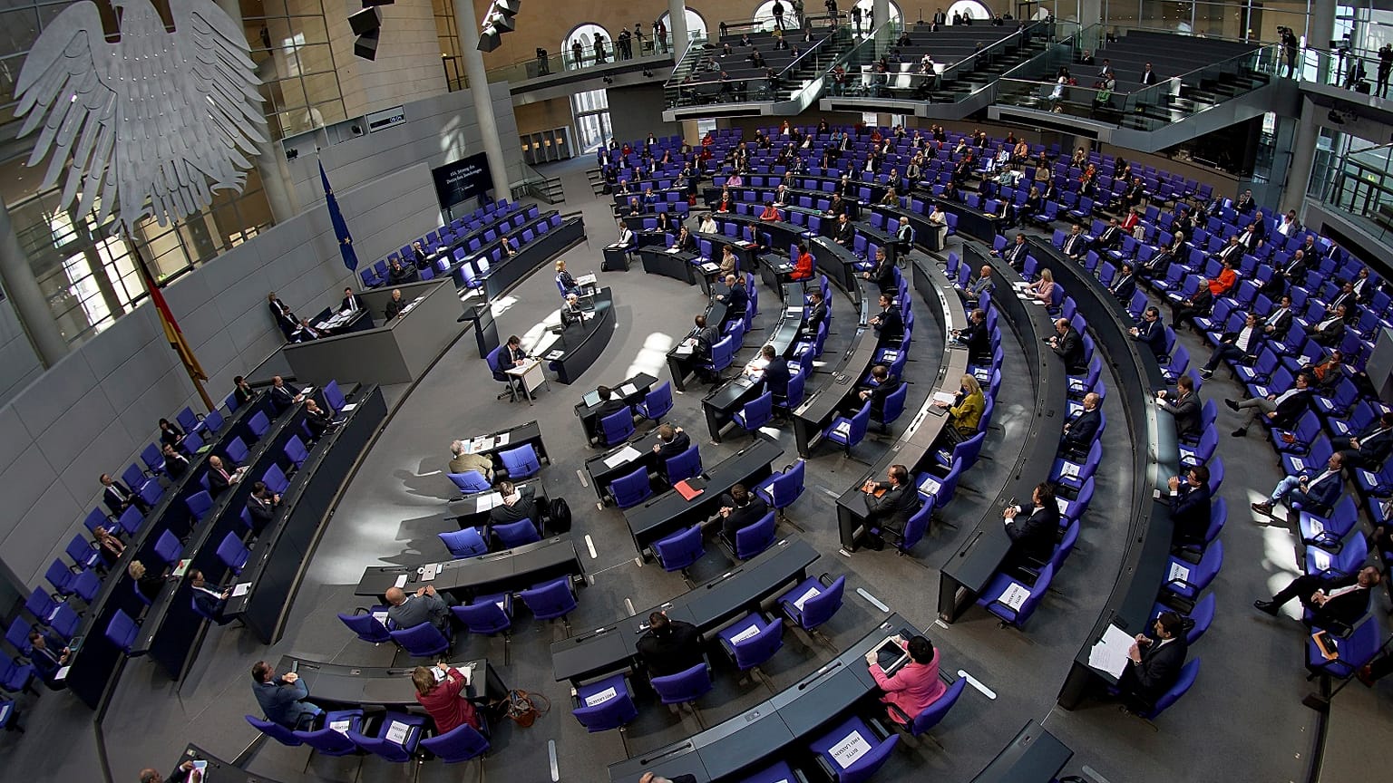 Lawmakers attend a meeting of the German federal parliament, or Bundestag, at the Reichstag building in Berlin.
