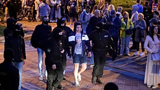 Police detain a protester during a Belarusian opposition supporters rally at Independence Square in Minsk.
