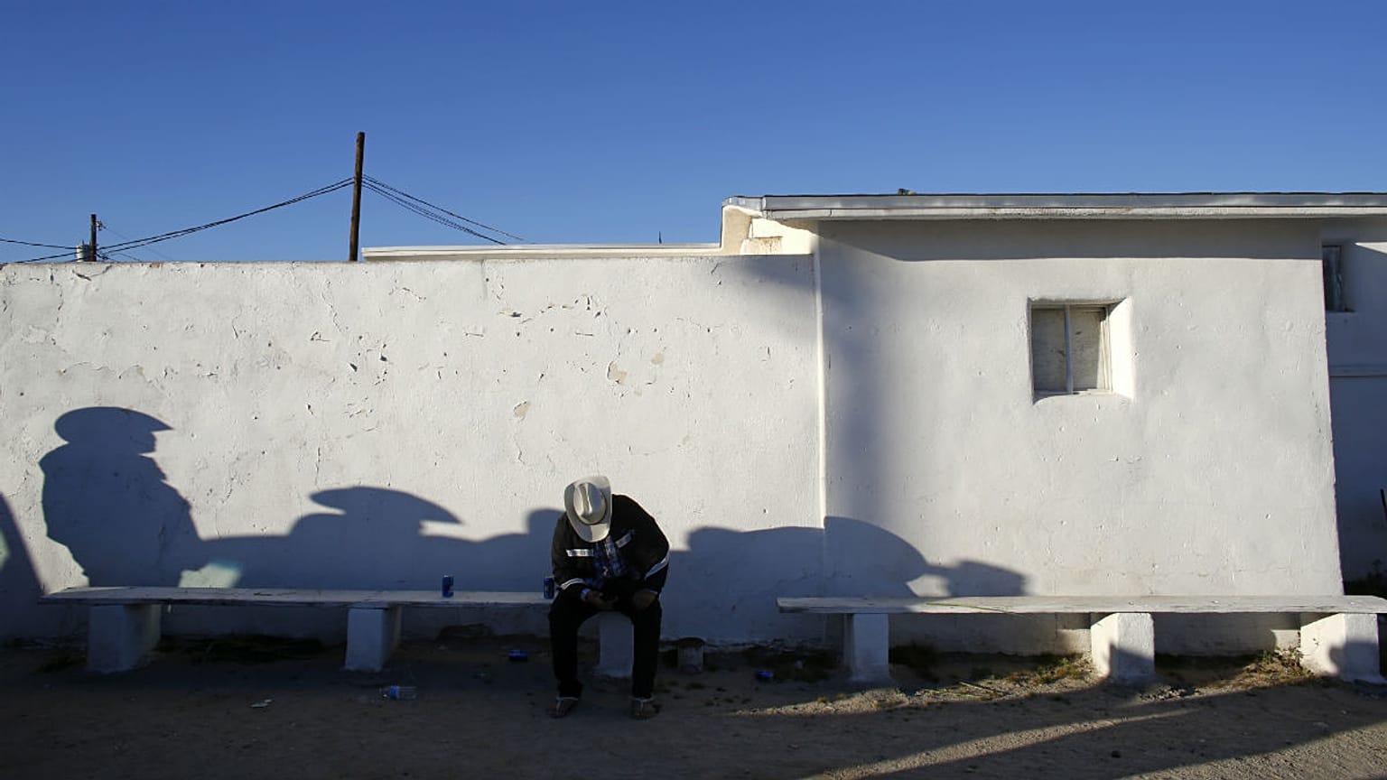 A man sat near south border of Phoenix with Mexico