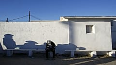 A man sat near south border of Phoenix with Mexico