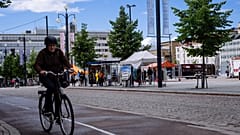 A cyclist rides past in Lathi, Finland, on August 24, 2020