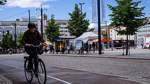 A cyclist rides past in Lathi, Finland, on August 24, 2020