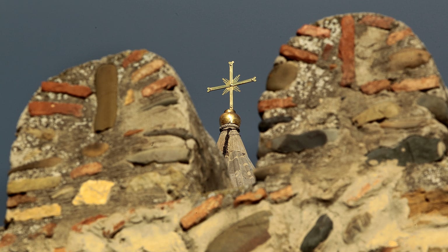 The cross on top of the Svetitskhoveli Orthodox cathedral in Mtskheta, Georgia