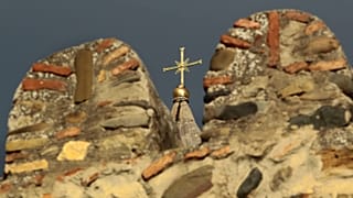 The cross on top of the Svetitskhoveli Orthodox cathedral in Mtskheta, Georgia