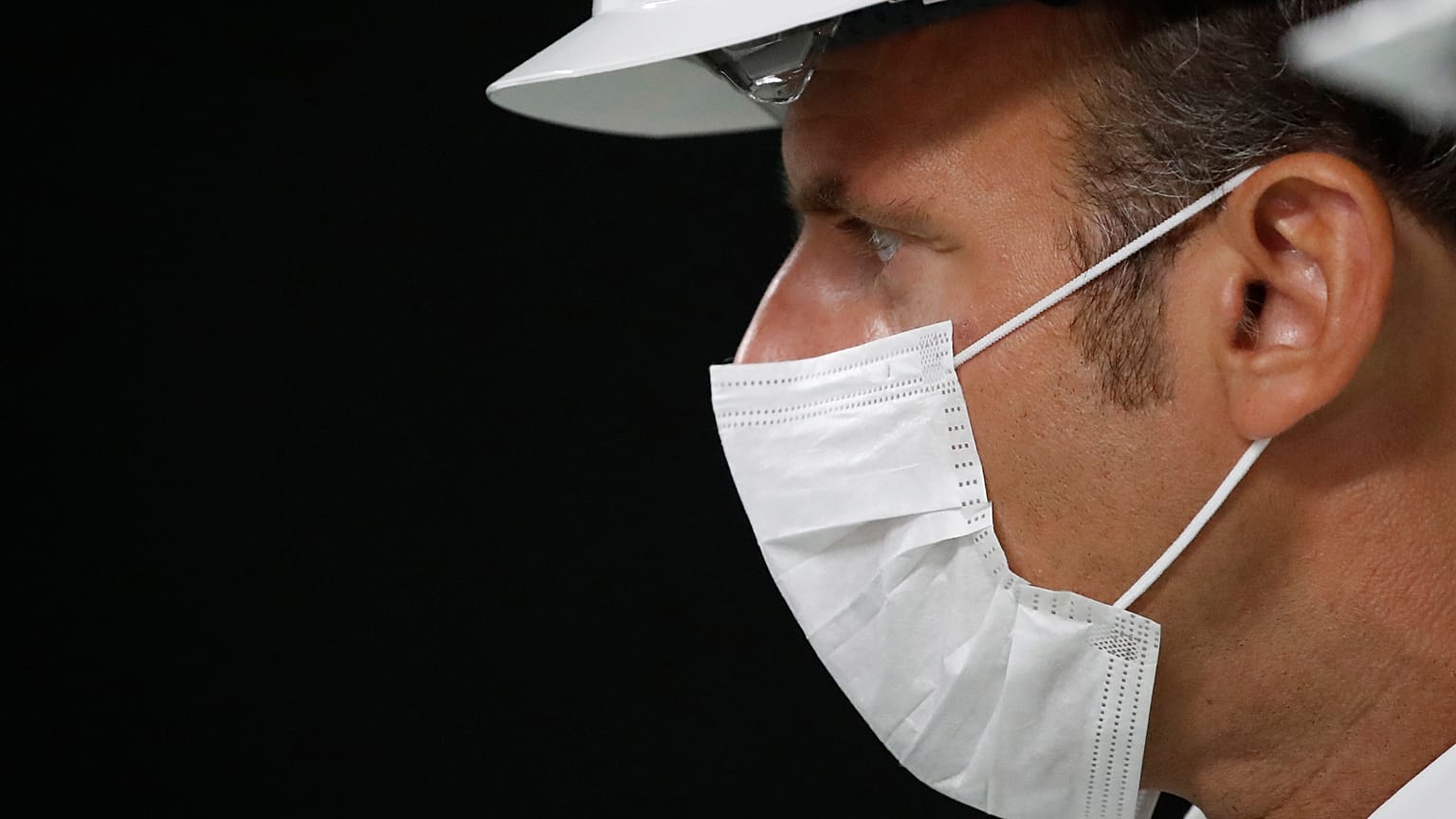 Emmanuel Macron wearing a protective mask in Villeneuve-la-Garenne, near Paris, Friday Aug. 28, 2020
