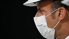 Emmanuel Macron wearing a protective mask in Villeneuve-la-Garenne, near Paris, Friday Aug. 28, 2020