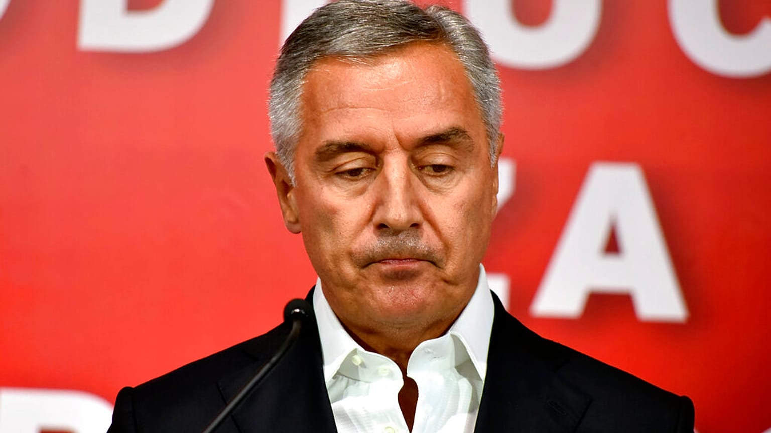 Montenegrin President Milo Djukanovic speaks at his DPS party headquarters in Podgorica, Montenegro, early Monday, August 31