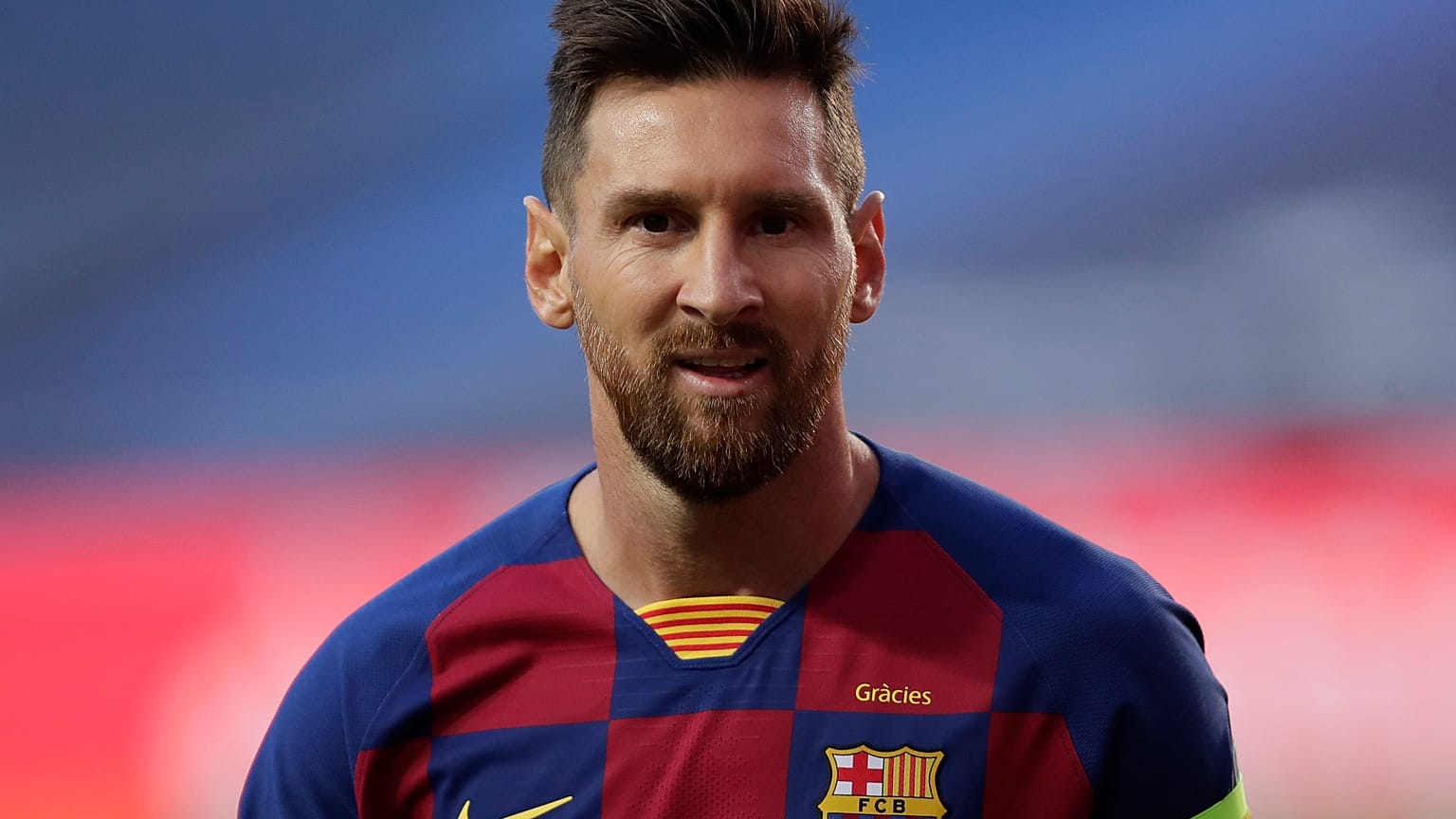 Barcelona's Lionel Messi looks on during the Champions League quarterfinal match between FC Barcelona and Bayern Munich in Lisbon, Portugal, Friday, Aug. 14 2020