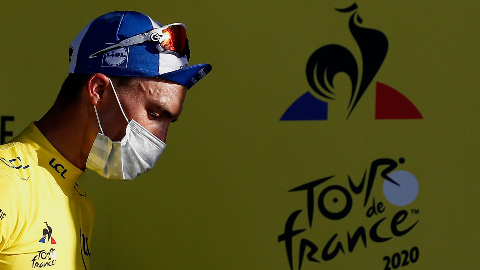 France's Julian Alaphilippe, wearing the overall leader's yellow jersey arrives on podium after winning the second stage of the Tour de France cycling race. Nice, Aug 30, 2020