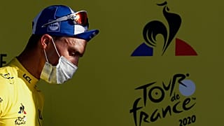 France's Julian Alaphilippe, wearing the overall leader's yellow jersey arrives on podium after winning the second stage of the Tour de France cycling race. Nice, Aug 30, 2020
