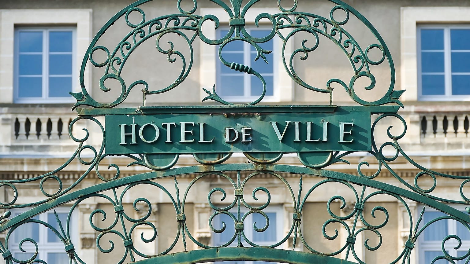 The gate is pictured outside a town hall in France.