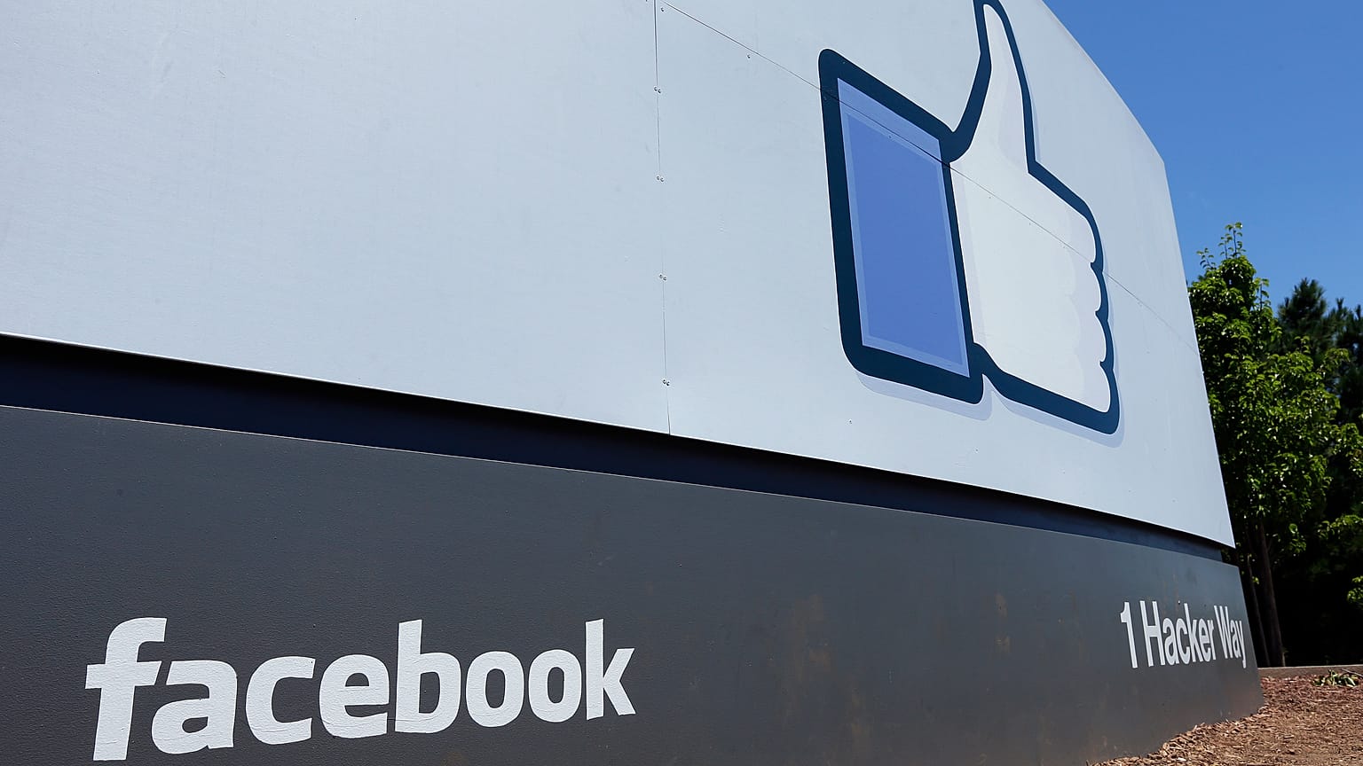 FILE - This July 16, 2013 file photo shows a sign at Facebook headquarters in Menlo Park, Calif. 
