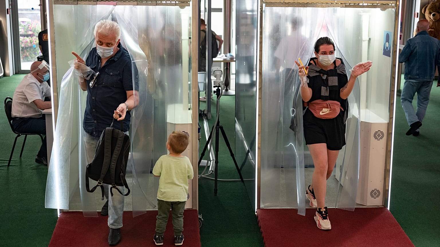 Passages equipped with disinfectant sprays at a shopping mall entrance in Moscow, Russia