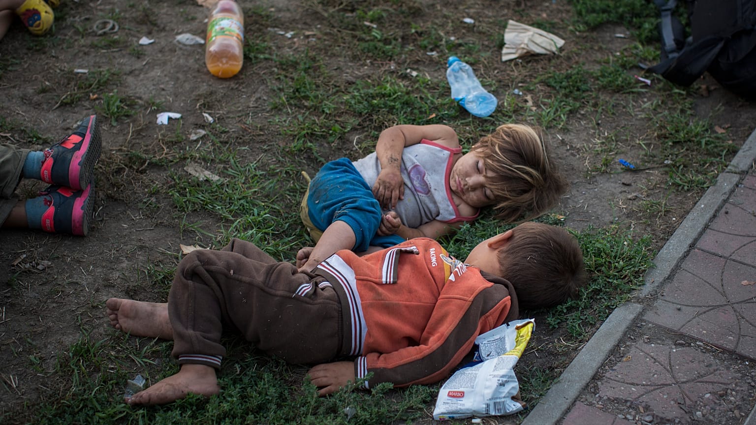 Syrian children sleep in a park in Belgrade, Serbia