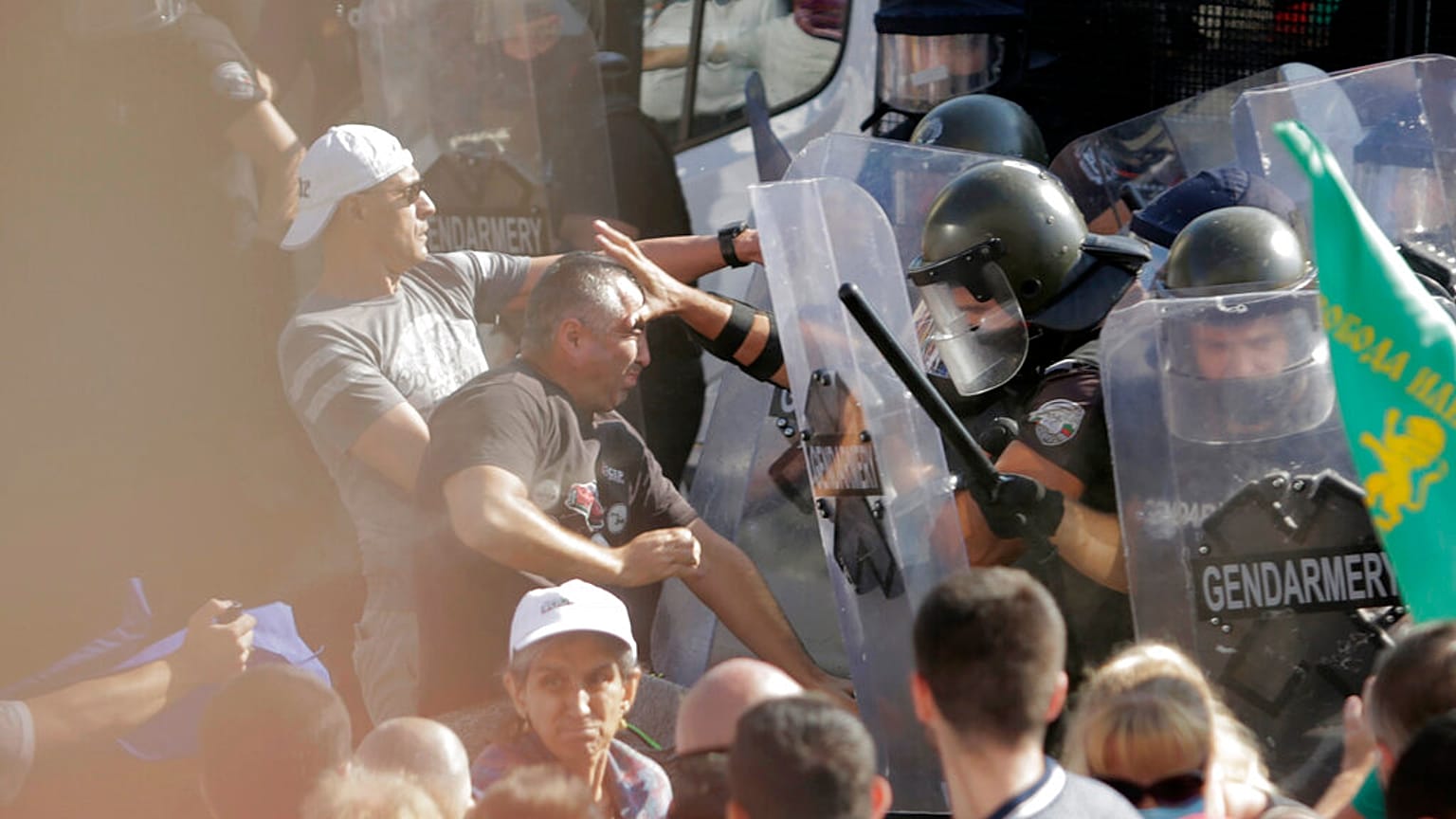 Police scuffle with protesters during rally in front of the new National Assembly building, demanding government resignation in Sofia on Wednesday, Sept. 2, 2020. 