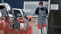Staff work at a the COVID-19 testing facility at Ikea near the Wembley stadium in London, Wednesday, April 29, 2020. 