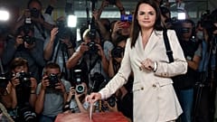 In this Aug. 9, 2020, file photo, Sviatlana Tsikhanouskaya casts her ballot at a polling station during the presidential election in Minsk, Belarus. 