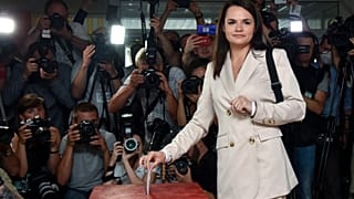 In this Aug. 9, 2020, file photo, Sviatlana Tsikhanouskaya casts her ballot at a polling station during the presidential election in Minsk, Belarus.