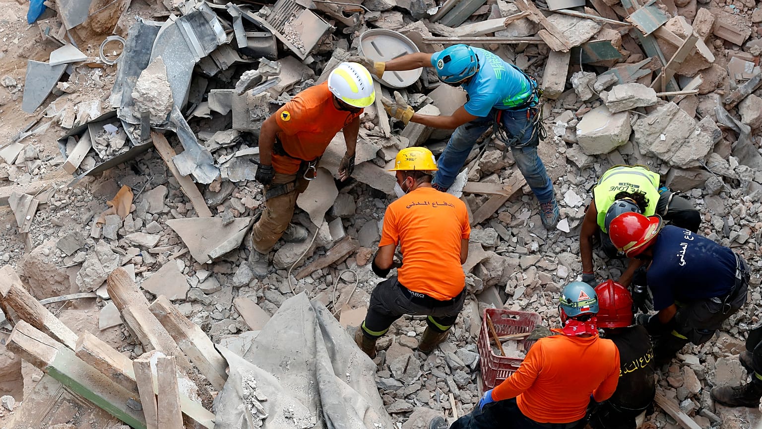 Rescuers search the site of a collapsed building after signals indicated there may be a survivor under the rubble, Beirut, Lebanon. Sept. 4, 2020.