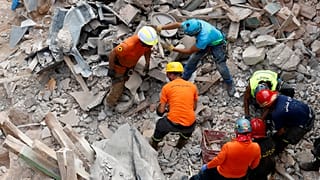 Rescuers search the site of a collapsed building after signals indicated there may be a survivor under the rubble, Beirut, Lebanon. Sept. 4, 2020.