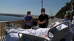 After months in ICU, a patient takes in the sea view in Barcelona