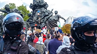 A few hundred people gather during an anti-mask demonstration in Paris on August 29