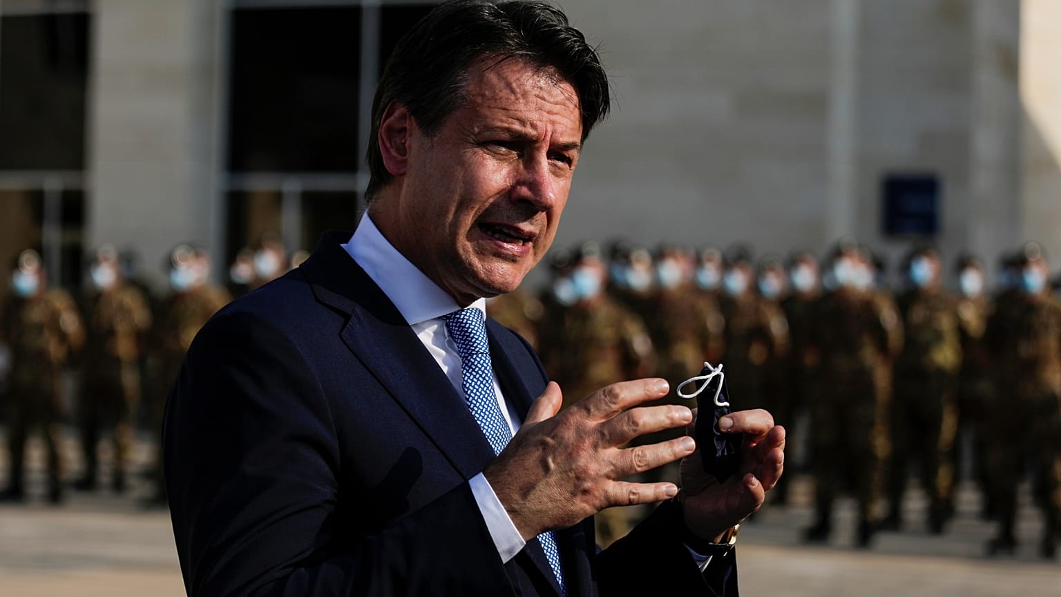 Italian Prime Minister Giuseppe Conte speaks to journalists as he visits an Italian field hospital set up at the Lebanese University in the Hadath district of Beirut, Lebanon,