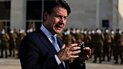 Italian Prime Minister Giuseppe Conte speaks to journalists as he visits an Italian field hospital set up at the Lebanese University in the Hadath district of Beirut, Lebanon,