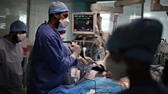 Medical workers tend to a patient affected with COVID-19 in a Marseille hospital, southern France, Thursday, Sept.10, 2020.