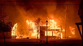 Buildings are engulfed in flames as a wildfire ravages the Oregon town of Talent on September 8, 2020.