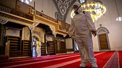 Disinfection team disinfect the premises of the grand mosque in capital Pristina, Kosovo.